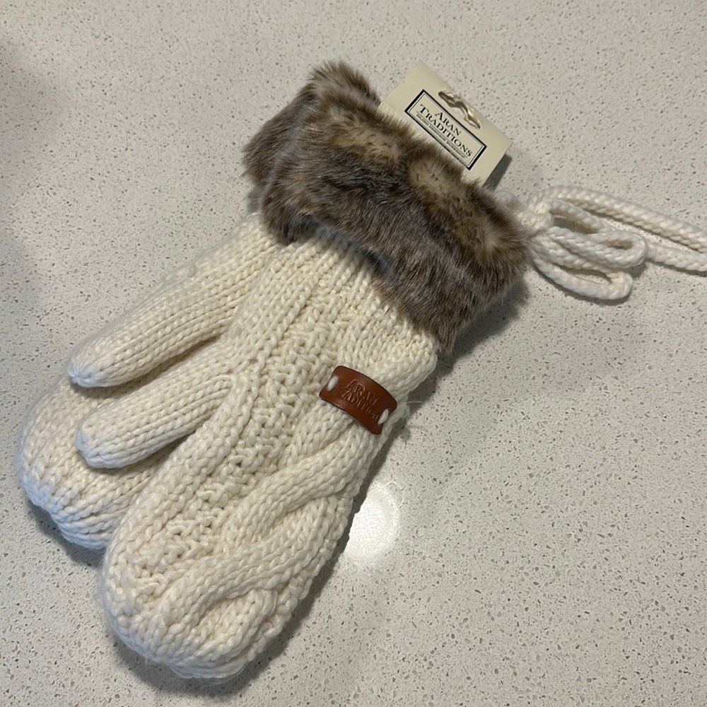 Cable knit mittens with faux fur. Never worn.